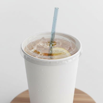 Clear PET flat lid with straw on 32oz paper cup lifestyle
